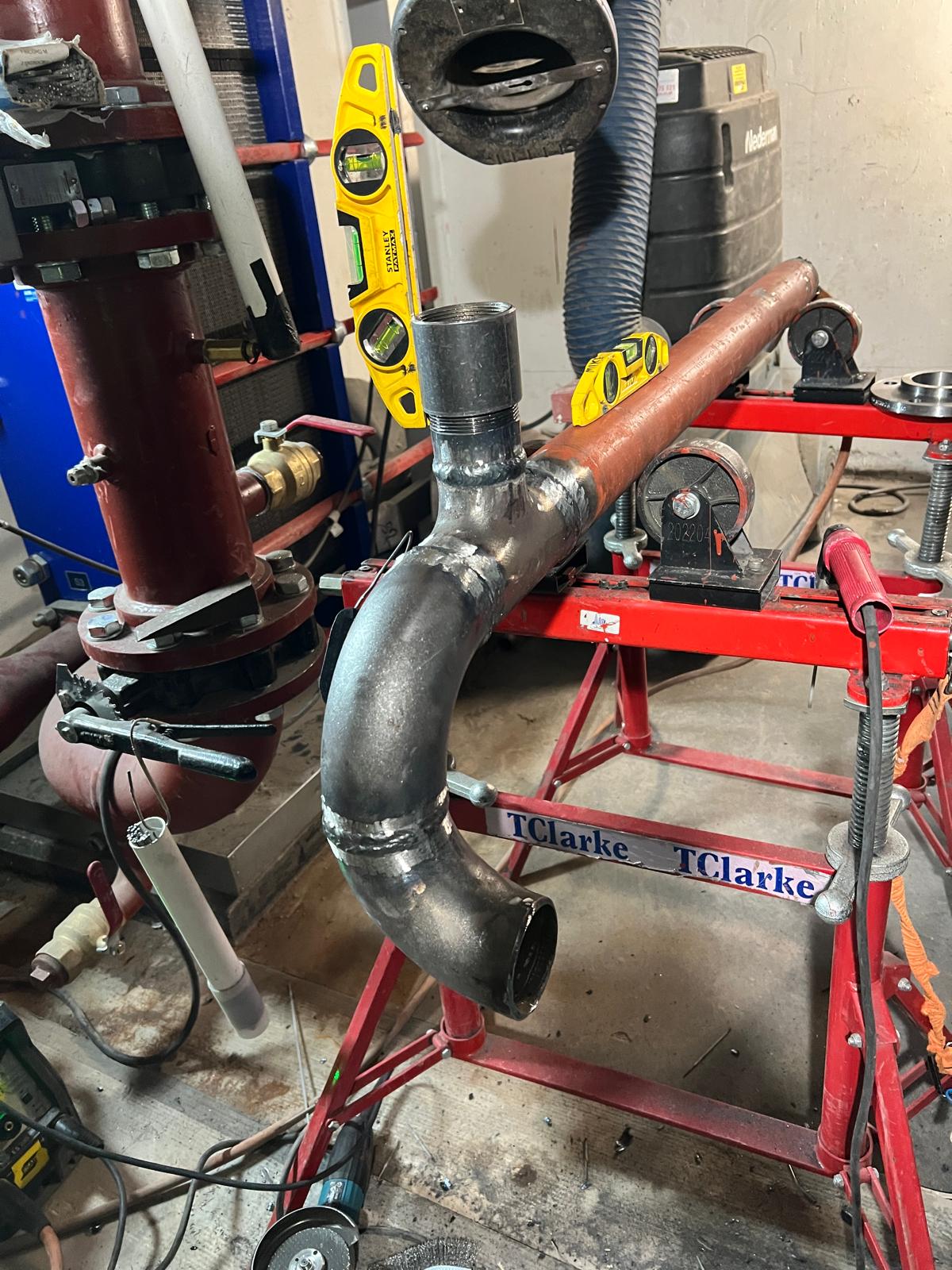 Pipe spool with sections welded and levels checking the line